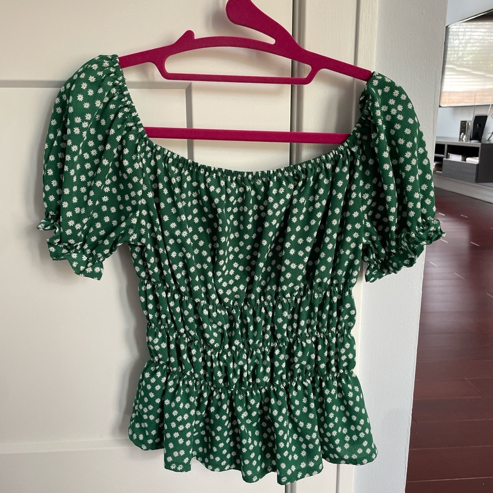 babydoll dark green top with white flowers (possible daisies)